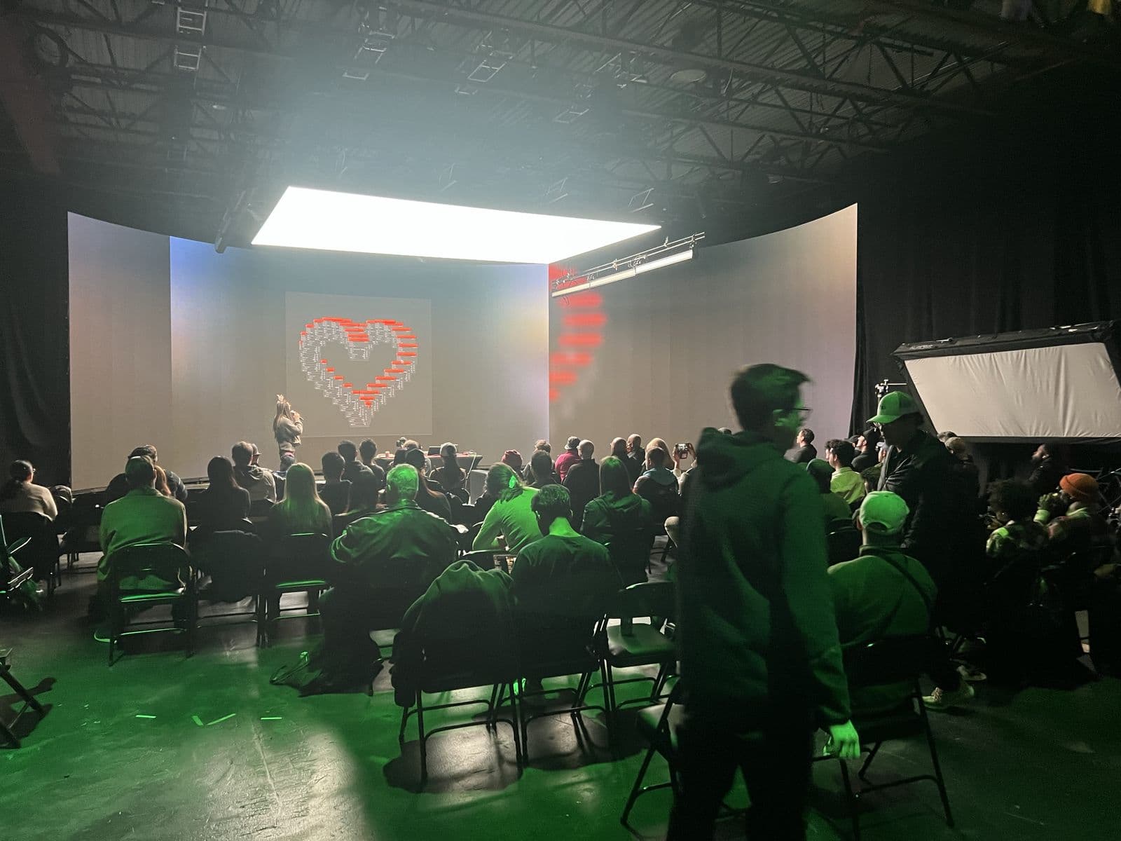 The room under stage lighting during a live demo